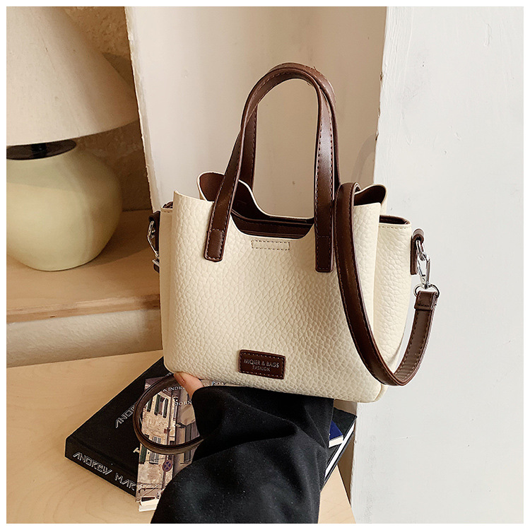Coreano simple bolso de mano de contraste de color mujer 2026 nueva tendencia de moda de gran capacidad bolso de hombro bolso versátil