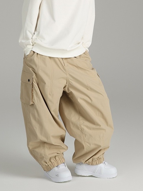 Pantalones de snowboard a prueba de viento impermeables sueltos de primavera y otoño pantalones de hombres y mujeres deportes al aire libre multi-Bolsillo casual pantalones atados al tobillo