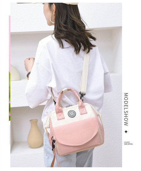 The Mommy bag is small and cute. It has a detachable front pocket and is a multi-functional baby bag. It is waterproof, lightweight, and has a crossbody design. It can be used to carry milk bags undefined