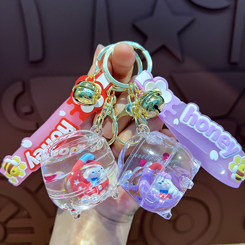 Creativo en la olla de arroz de aceite de la luna de orejas perros llaveros lindos dibujos animados pareja colgante garra máquina pequeños regalos al por mayor