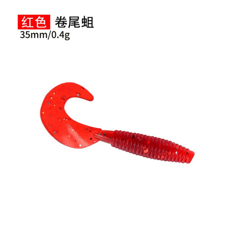 Factory-supplied bulk soft lures—curly-tail grubs for lure fishing, lead-head hooks, Texas rig setups, and salt-infused, fishy-smelling soft worms.