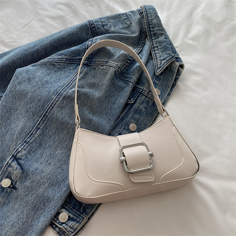 Versión coreana del bolso de axila de alta gama, popular de este año, bolso de palo francés de estilo occidental, diseño de nicho, bolso de hombro de temperamento de moda, viaje