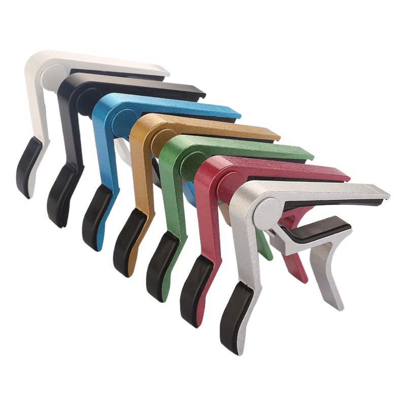 Guitarra popular capo ukulele guitarra de madera universal metal sintonizador instrumento musical accesorios al por mayor