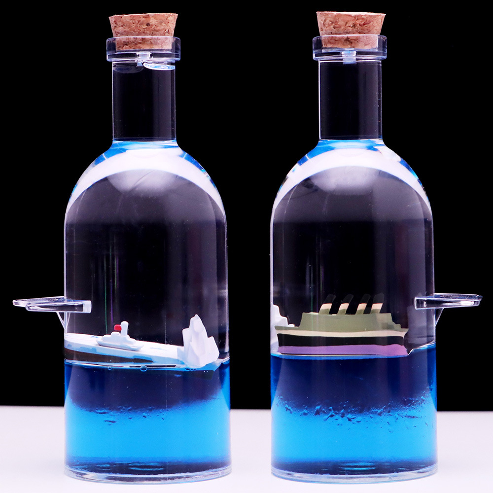 Botella a la deriva montando el viento y rompiendo las olas Botella de vela Perla Negra reloj de arena gotas de aceite Regalo de Cumpleaños descompresión decoración de escritorio al por mayor