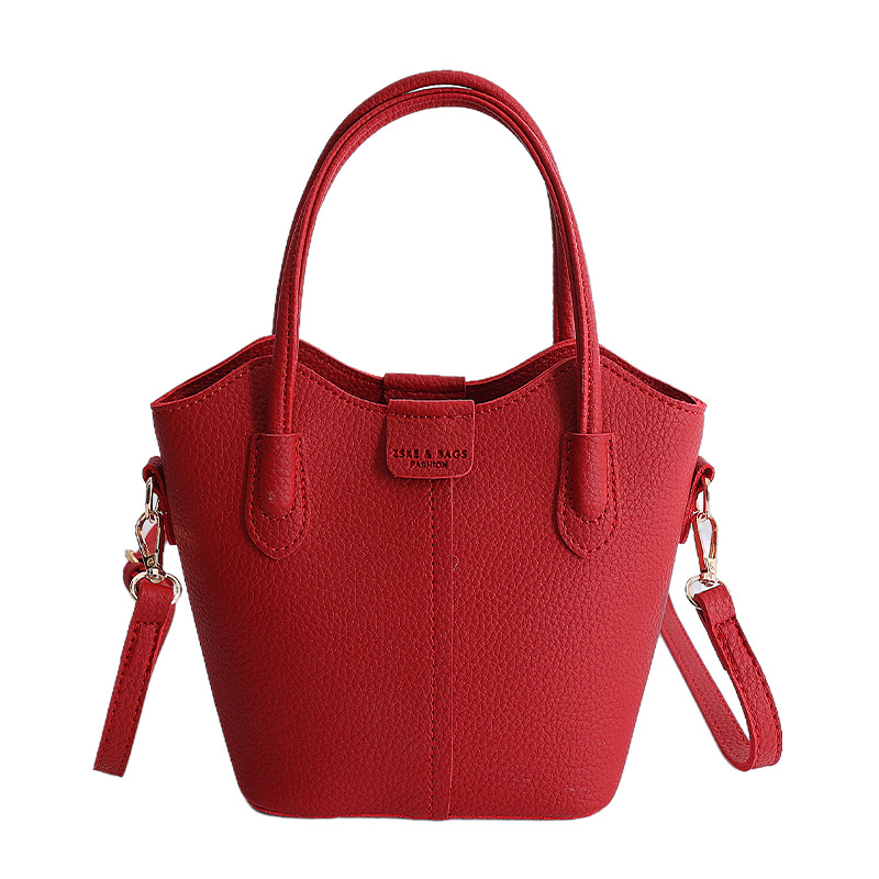 Bolso de mano de moda retro 2026 nuevo temperamento simple bolso de cubo de viaje ocio mochila de hombro