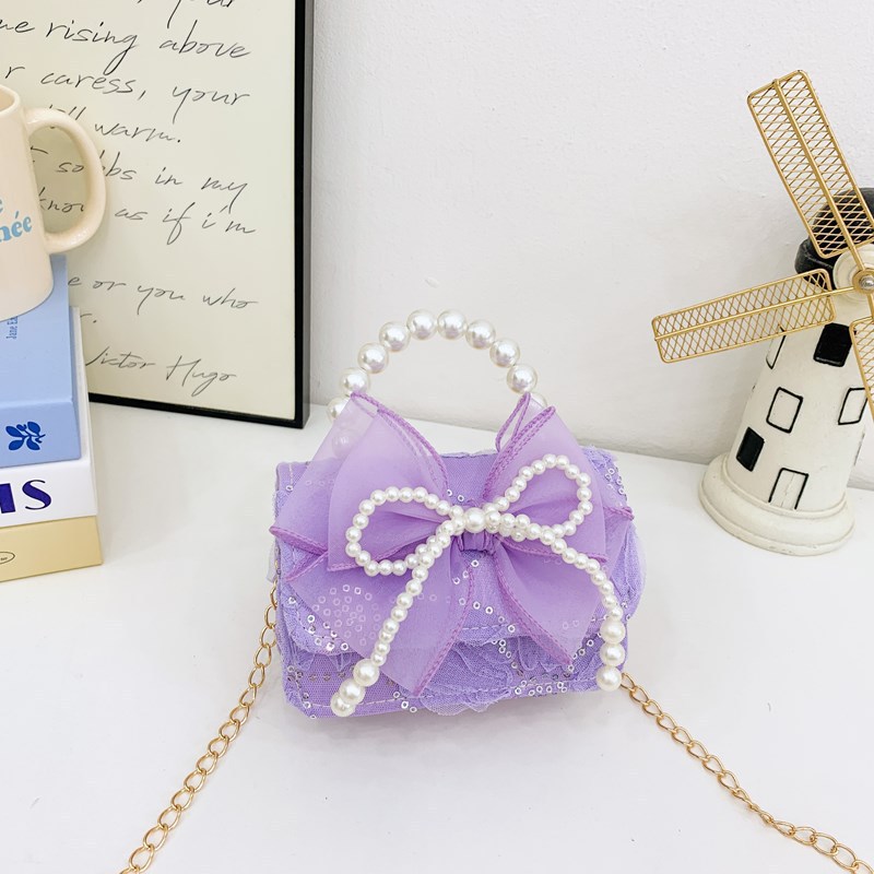 Nueva princesa flor de encaje niñas mochila de hombro de moda perla arco bolso de niños bolso de cambio de dibujos animados