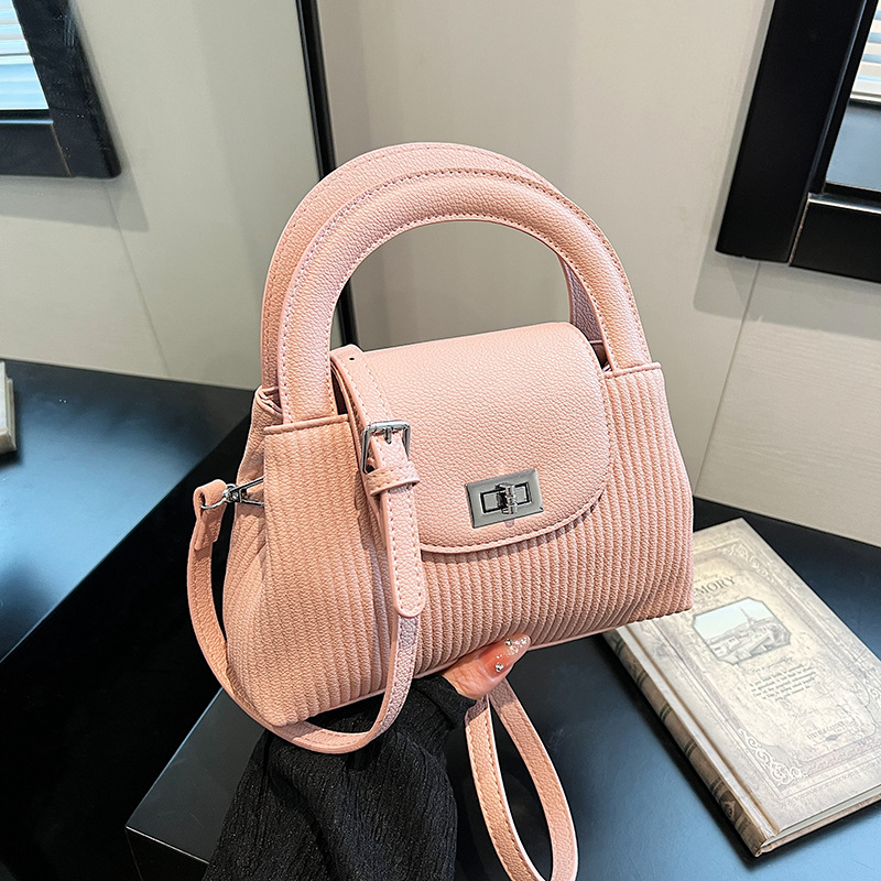Bolso de moda coreano 2025 verano nuevo bolso femenino casual patrón de lichi bolso de hombro a rayas todo fósforo bolso de mensajero