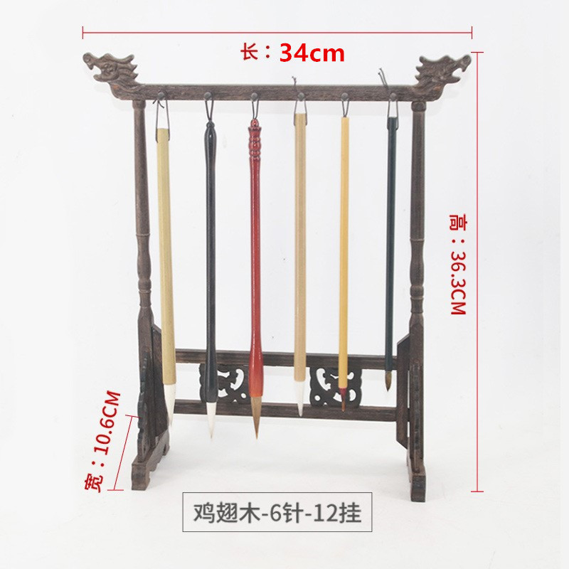 文房四宝のペンホルダーのペンは赤い木を掛けて多く蛇口のペンを使って大きい小さいサイズの手羽の木のプラスチックの筆の棚を置いて卸売りします。|undefined