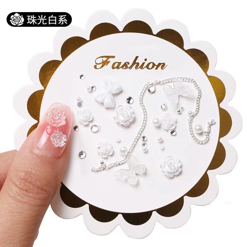 Manicure camellia material paquete de joyería pequeño libro rojo explosión arco mezcla de cadena de joyería de uñas accesorios al por mayor