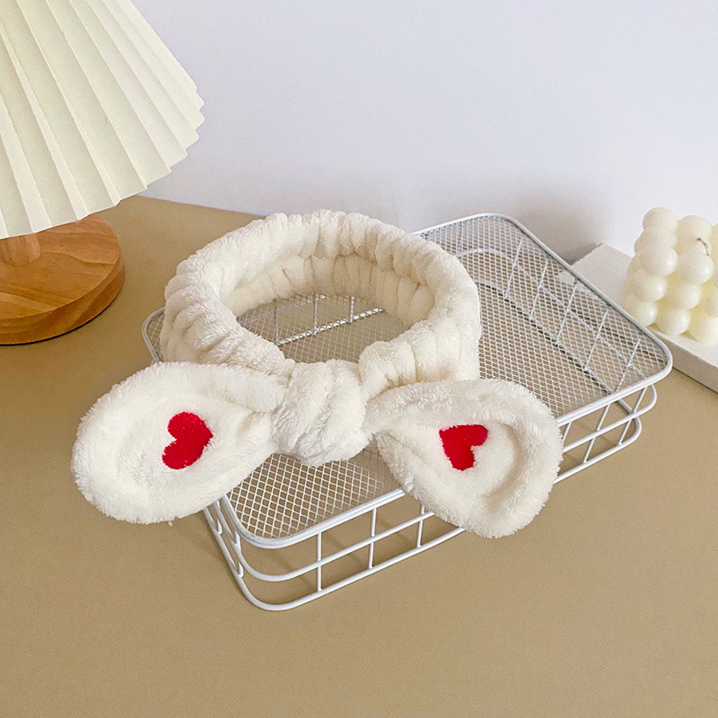 Celebridad en línea estilo coreano bordado pequeño corazón arco banda para el cabello deportes de las mujeres yoga pañuelo cara lavado banda para el cabello accesorios para el cabello al por mayor