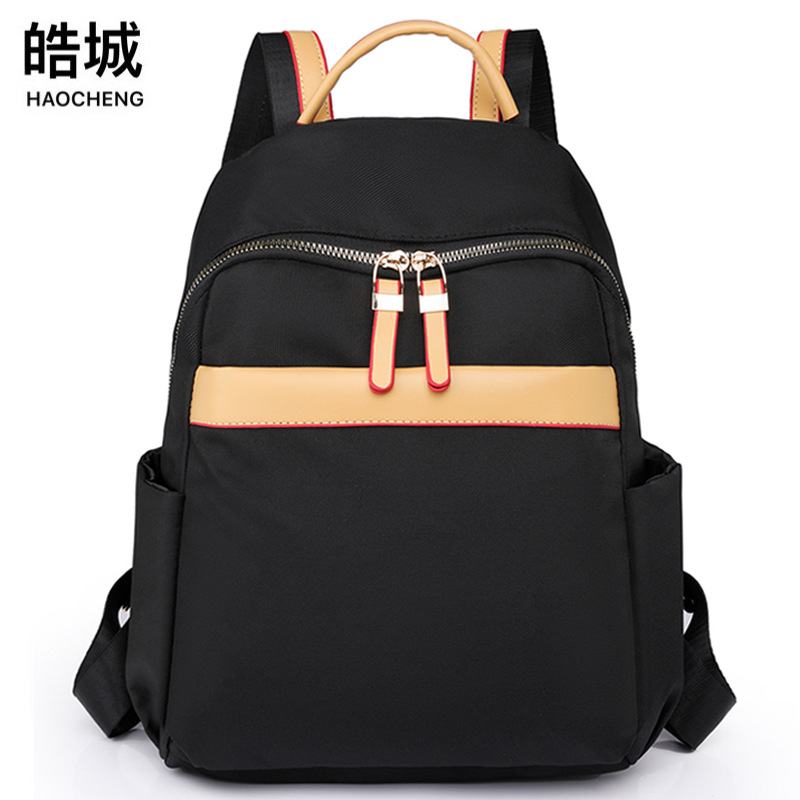 2023 nueva mochila de nailon para mujer de color de contraste moda simple de gran capacidad mochila de viaje al aire libre mochila escolar al por mayor