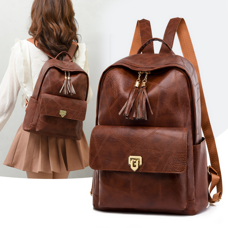 Comercio exterior al por mayor 2023 nueva mochila de PU para mujer retro simple y versátil color sólido de gran capacidad mochila para exteriores marea