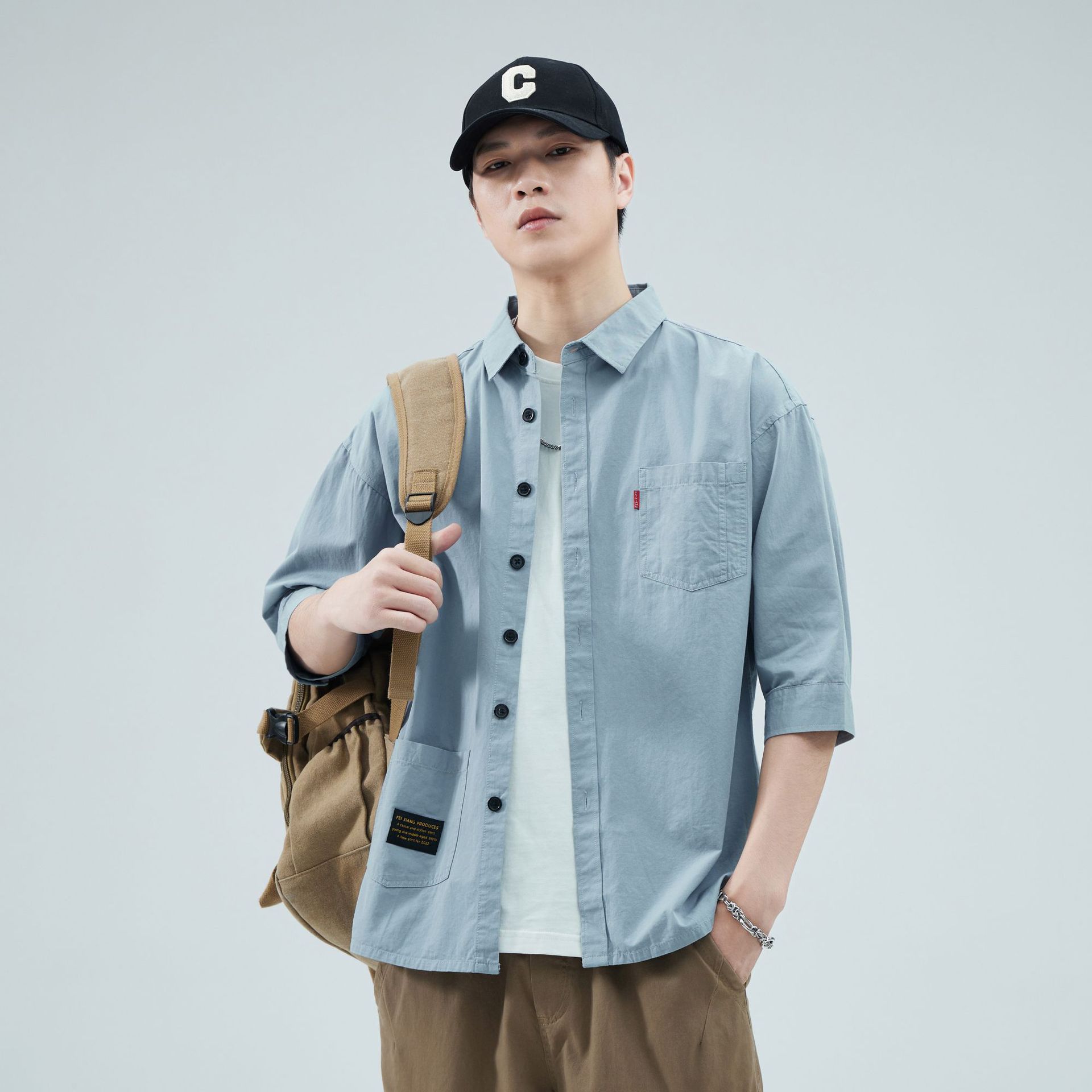 Camisas de primavera y verano para hombres, estilo americano de alta gama, estilo de moda de Hong Kong, estilo de varios bolsillos, camisa casual suelta