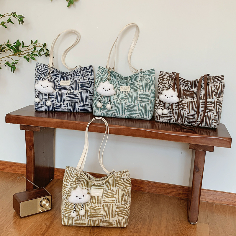 Bolsa multipropósito coreana de hombro de mujer, nicho de diseño de textura portátil, bolso de hombro de mujer, pequeño bolso fresco.