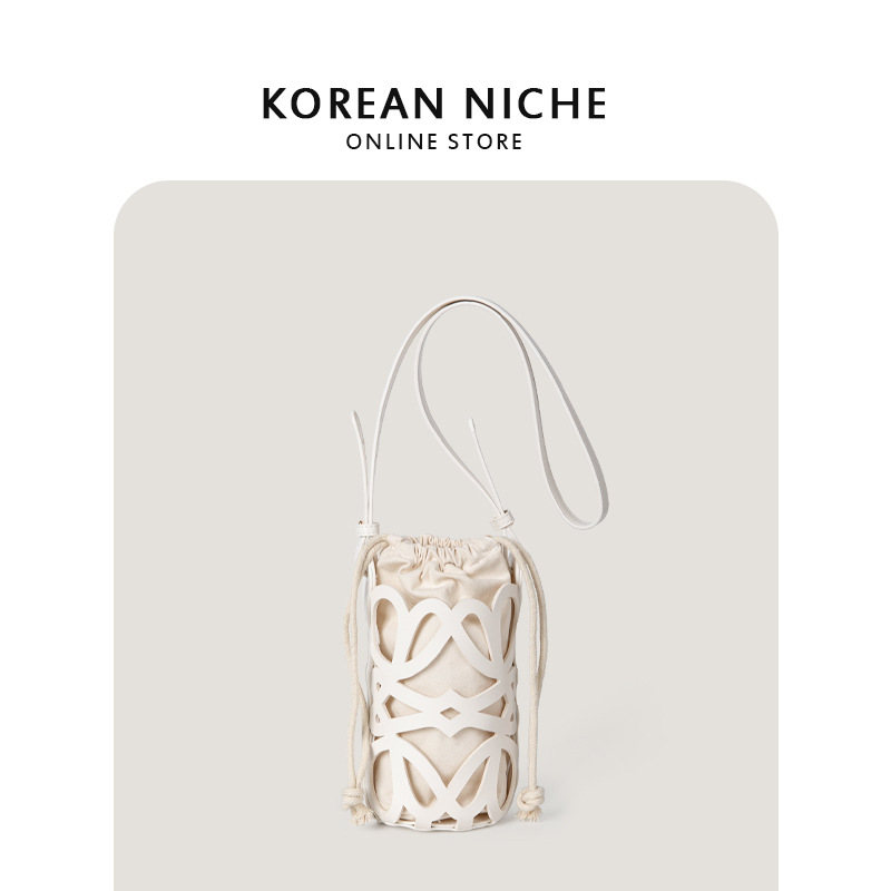 Bolso de mujer 2022 nuevo diseño de nicho hueco cordón lienzo cilindro pequeño bolso personalizado retro crossbody bolso de hombro