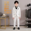 White jacket, trousers, shirt, brooch