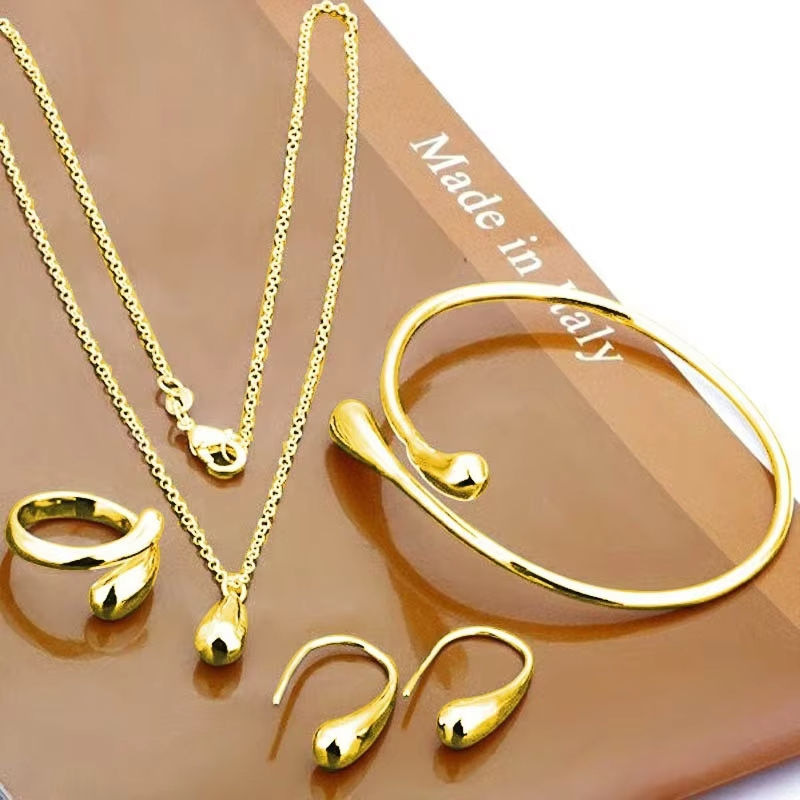 Europa y los Estados Unidos explotaron la moda de gota de agua, aretes de oro y plata, anillos, pulseras, collares de cuatro piezas, al por mayor