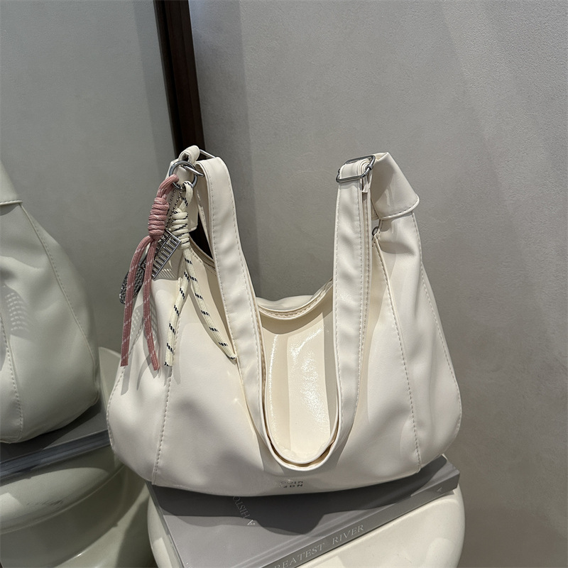 relajado cera de piel bolso de mujer 2025 nuevo estilo primavera y verano de moda de viaje bolsa de mano ocio versátil mochila
