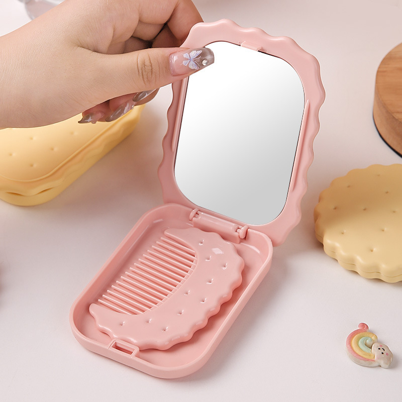Espejo plegable con forma de galleta, espejo de maquillaje para mujer con peine, espejo de mano para retoques para estudiantes, espejo de maquillaje plegable, exclusivamente para ventas transfronterizas.