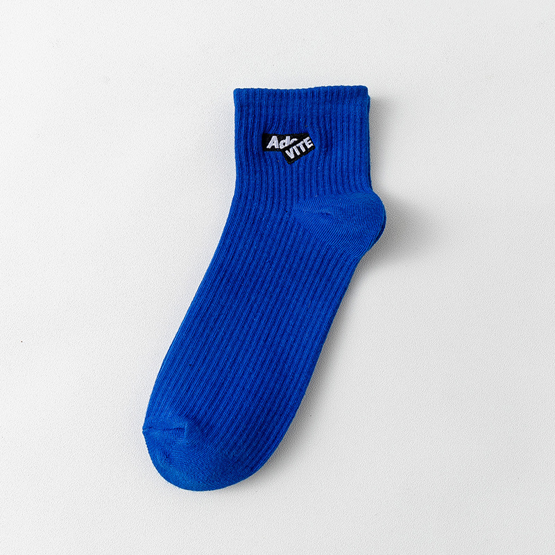 Algodón de color sólido primavera y verano unidireccional botón calcetines bordados letras rayas absorben sudor en el deporte de tendencia