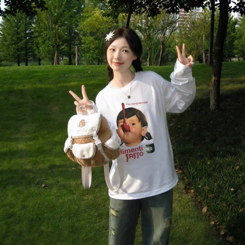 White long-sleeved women's loose-fitting top with a fun spoon and girl portrait, Korean-style, casual, versatile, lightweight, and suitable for layering White long-sleeved women's loose-fitting top with a fun spoon and girl portrait, Korean-style, casual, versatile, lightweight, and suitable for layering