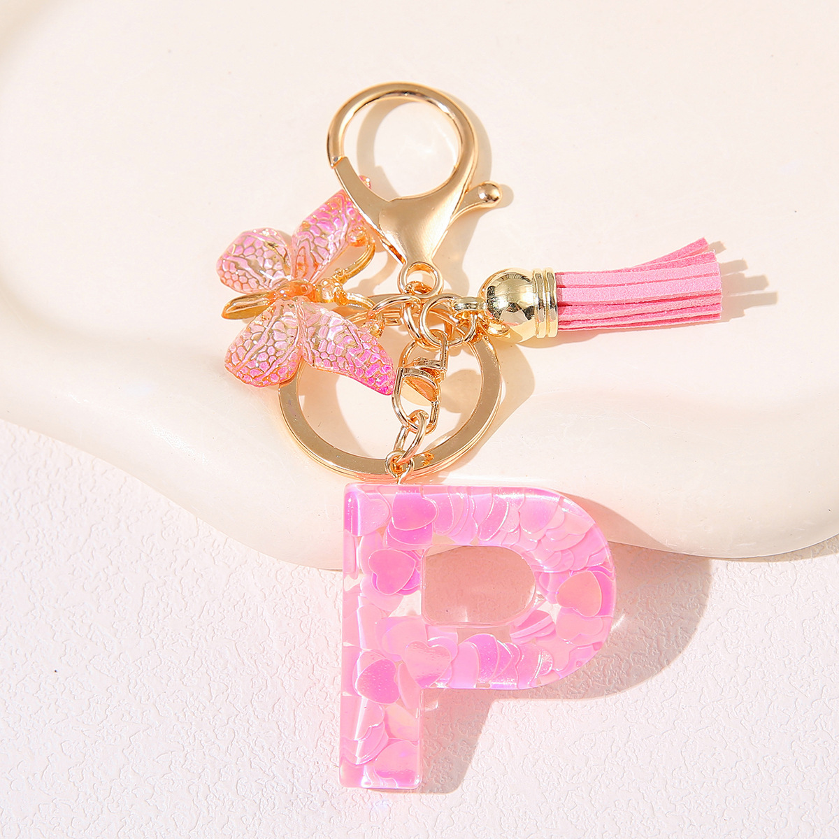 Nuevo rosa damas letras A-Z llavero de goteo de goma sequilla amor letras bordas mariposa llavero transfronterizo