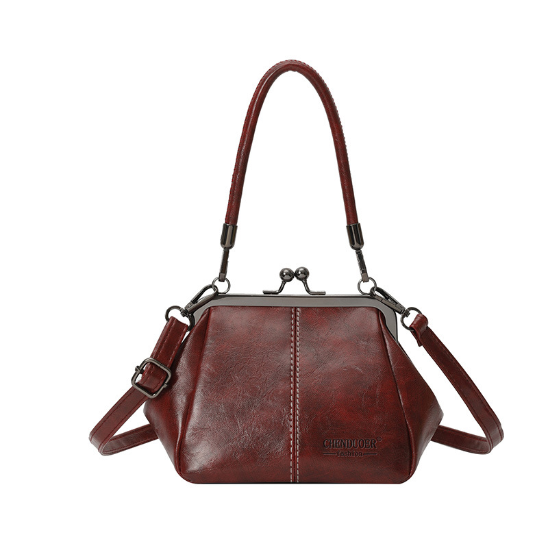 Bolso de conchas de moda para mujeres 2026 comercio exterior nuevo bolso coreano de abrazadera alta sensación retro versátil mochila