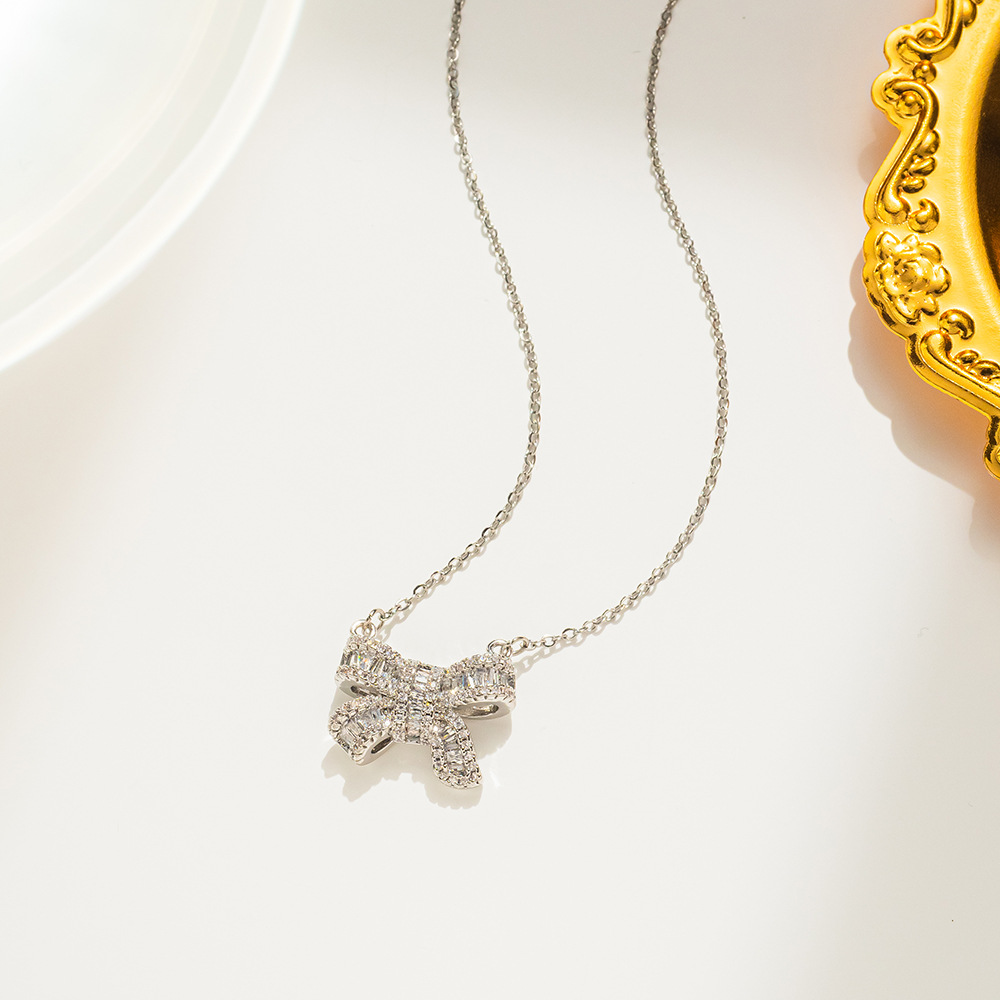 15g Weight 0.03µm-0.05µm Gold Plating Thickness PVD Coated Gold Plating Process Real Gold Plated Plating Material Copper Pendant Material Zircon Inlay Material Pendant Necklace Classification 316 Stainless Steel Chain Material cable chain Chain Type 1 Piece Quantity Daily, Date Occasion 316 Stainless Steel Material Bow Knot Pattern Women's Gender Simple Style Style Plating Craft PVD Coated Real Gold Plated Bow Knot Stainless Steel Simple Style Waterproof Non Tarnish Pendant Necklace
