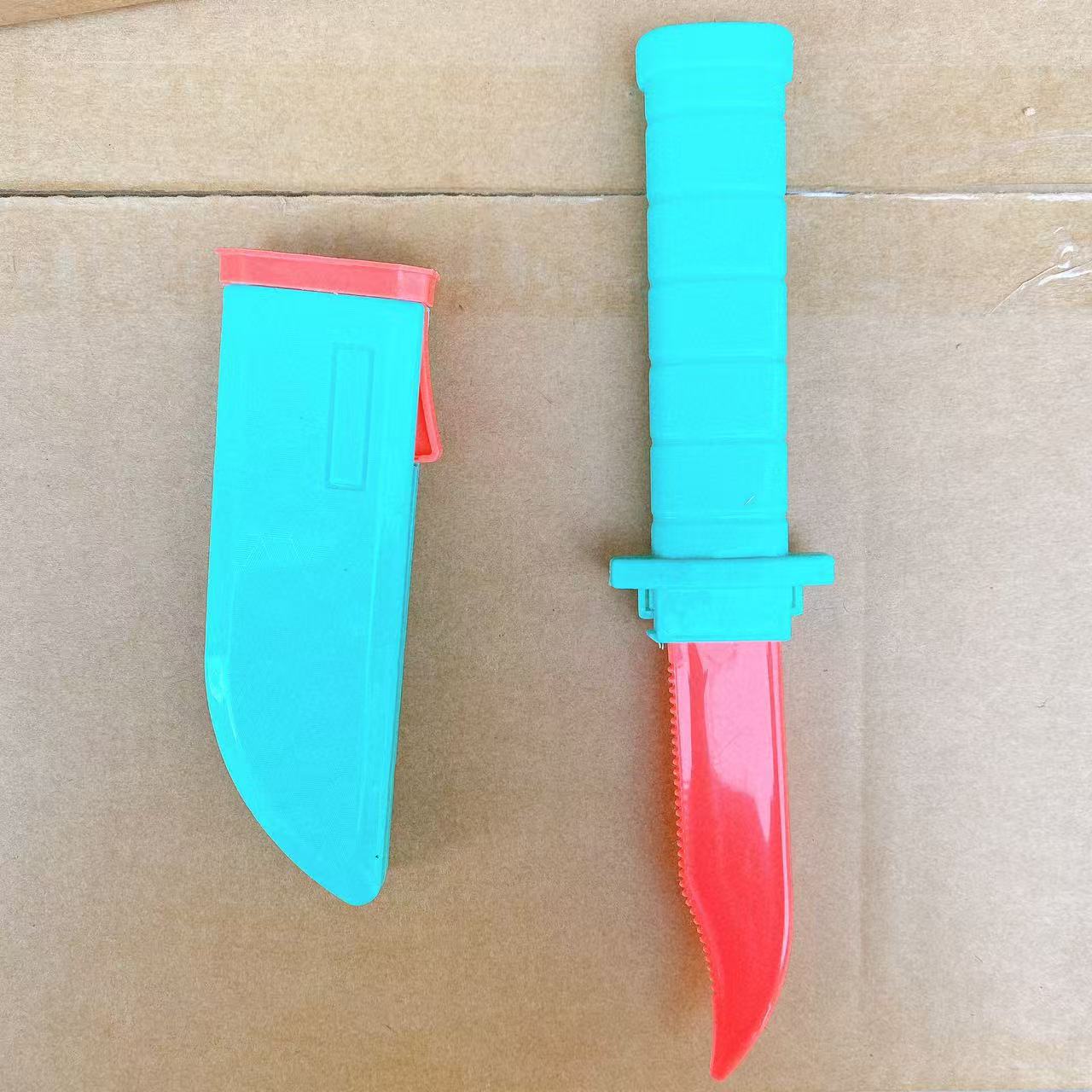 Cuchillo de resorte telescópico cuchillo de rábano colorido espectáculo de hechicería accesorios automáticamente bolsa de nuevo lote de juguetes infantiles
