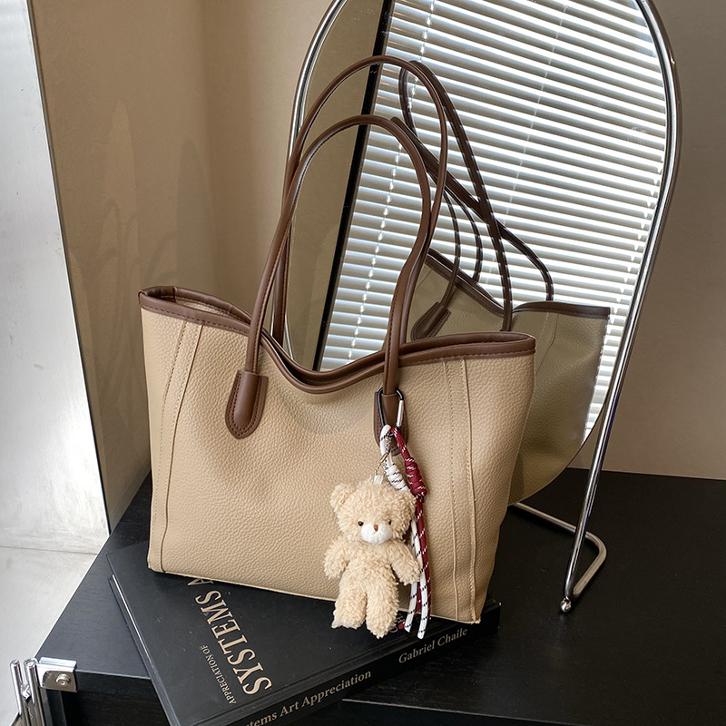 Bolso atmosférico de textura de viajero 2025 nuevo estilo de contraste de color de moda versión coreana de un solo hombro bolso de axila temperamento bolso de moda