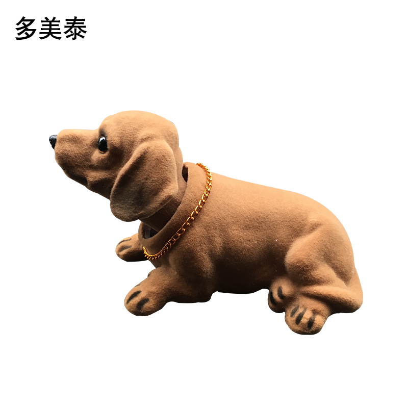 Suministro directo de fábrica resina flocado simulación salchicha perro cabeza móvil perro decoración del coche accesorios del coche simulación perro Decoración