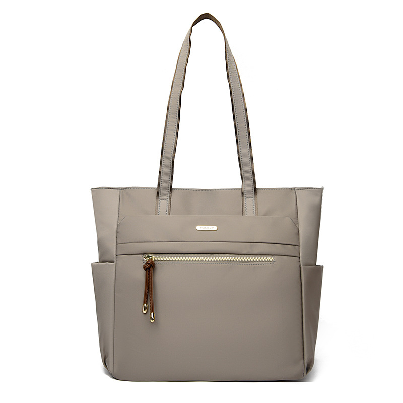 Bolso Tote casual coreano 2025 nueva moda textura de viaje salvaje bolso de mano de un solo hombro suministro directo de fábrica