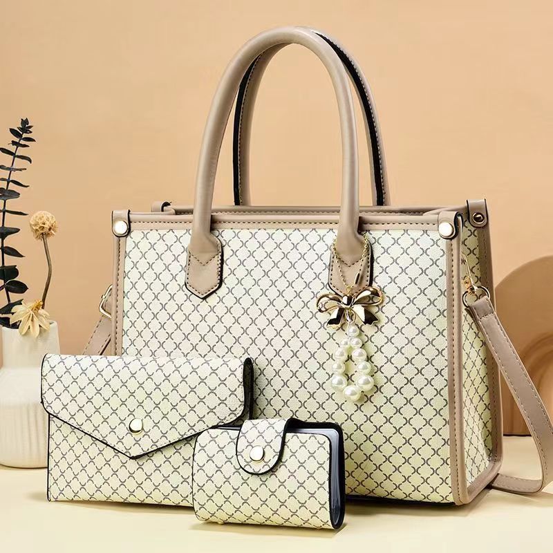 2026 nueva tendencia transfronteriza tres piezas paquete de bolsas para niños y madres, bolsas de mano portátiles de hombro simple y de gran capacidad