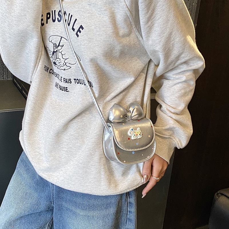 2026 nuevo bolso infantil caricatura perrito lindo arco bolso de cambio de moda punto de onda bolso accesorios de niña pequeña