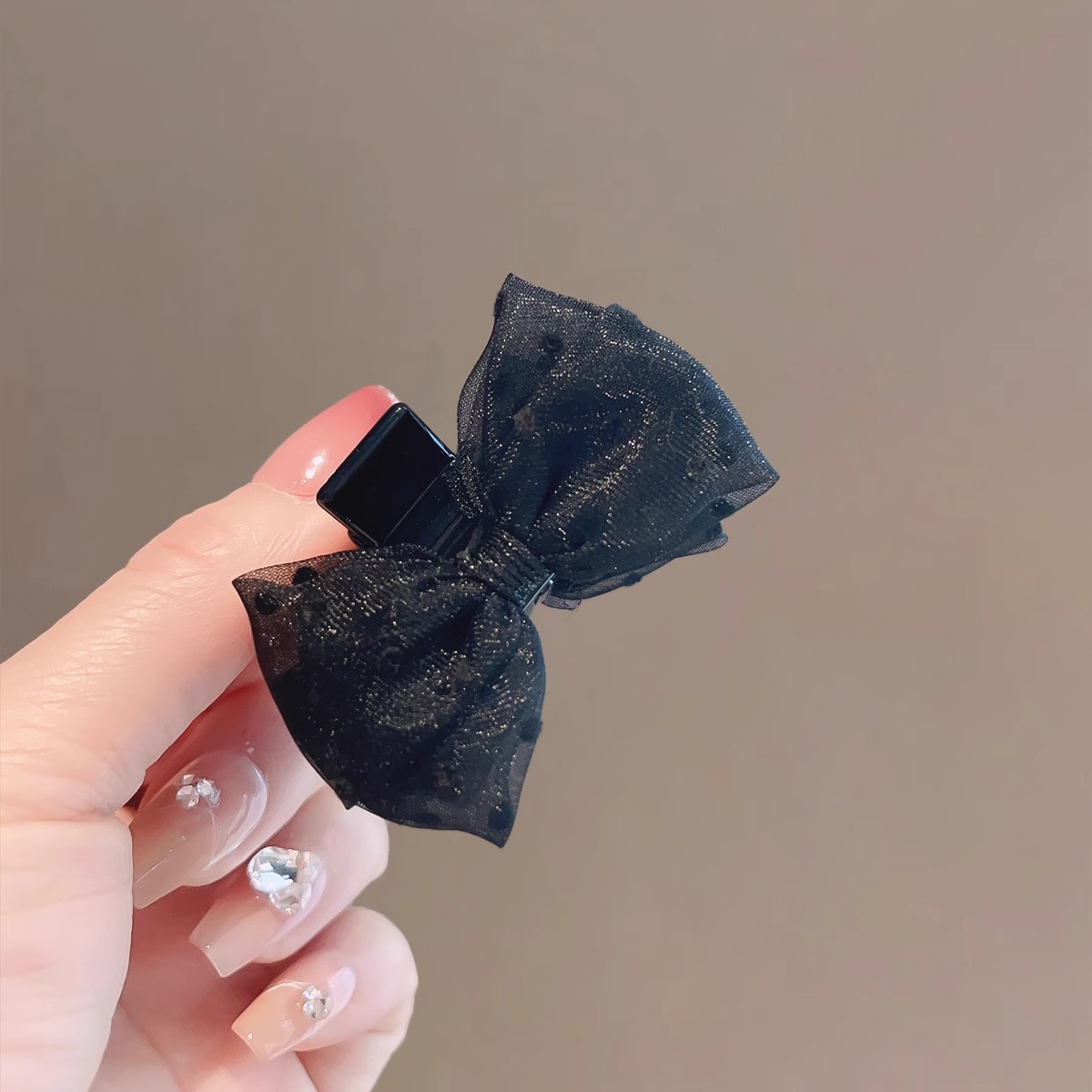 Black double-sided crab pin with bow