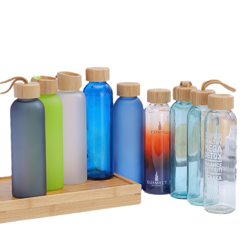 Venta al por mayor de color taza de publicidad de vidrio portátil taza de agua regalo de promoción taza de apertura taza de vidrio transfronterizo