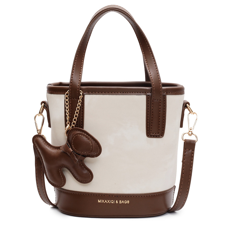 Este año, la popular bolso de mano super caliente para mujeres 2025 nuevo bolso de cubo retro versátil de alto nivel sensación de hombro mochila