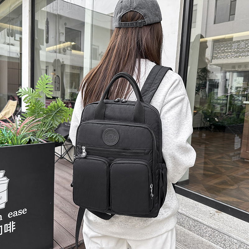2025 primavera nueva bolsa de mamá mochila de moda mochila de nylon mochila de viaje de gran capacidad mochila multifuncional