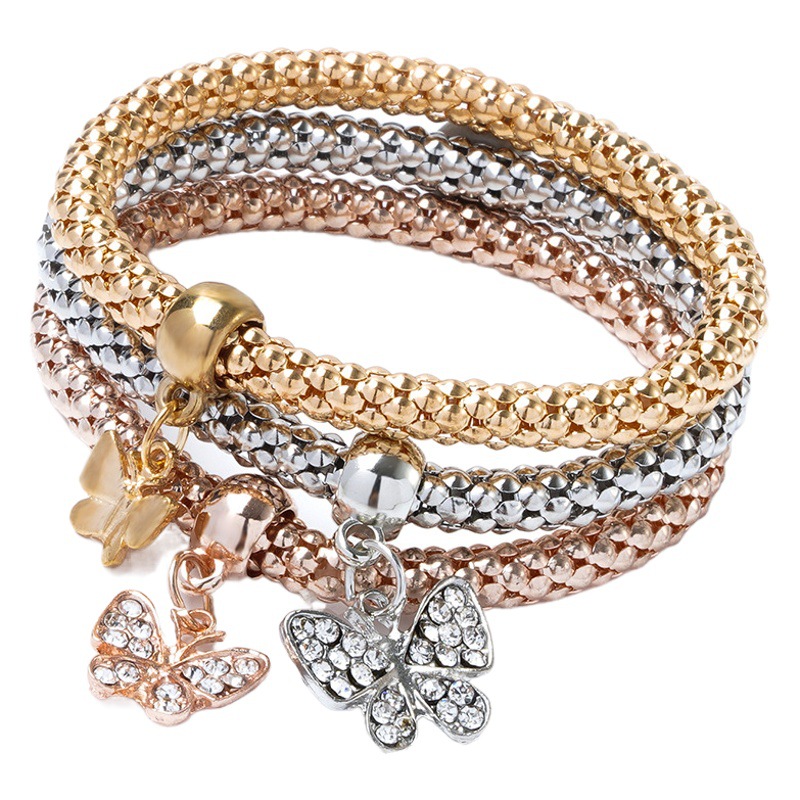 Europea y americana transfronteriza Venta caliente Aleación de tres colores traje elástico palomitas de maíz Cadena de diamantes incrustado amor colgante pulsera para las mujeres