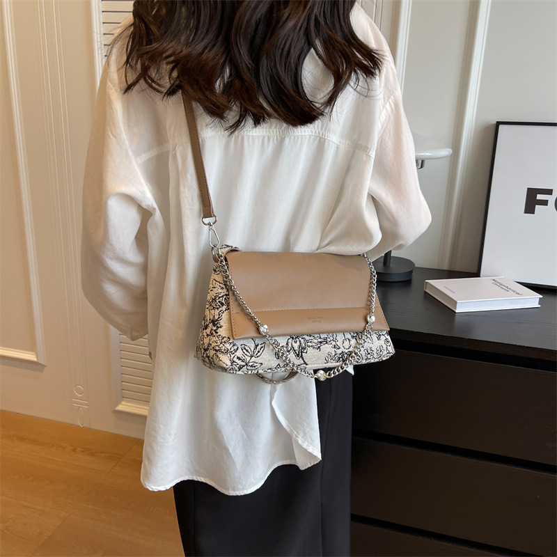Diseño coreano de nicho simple bolso de hombro de color contraste para mujeres verano 2026 nuevo estilo diario bordado bolso de viaje al trabajo