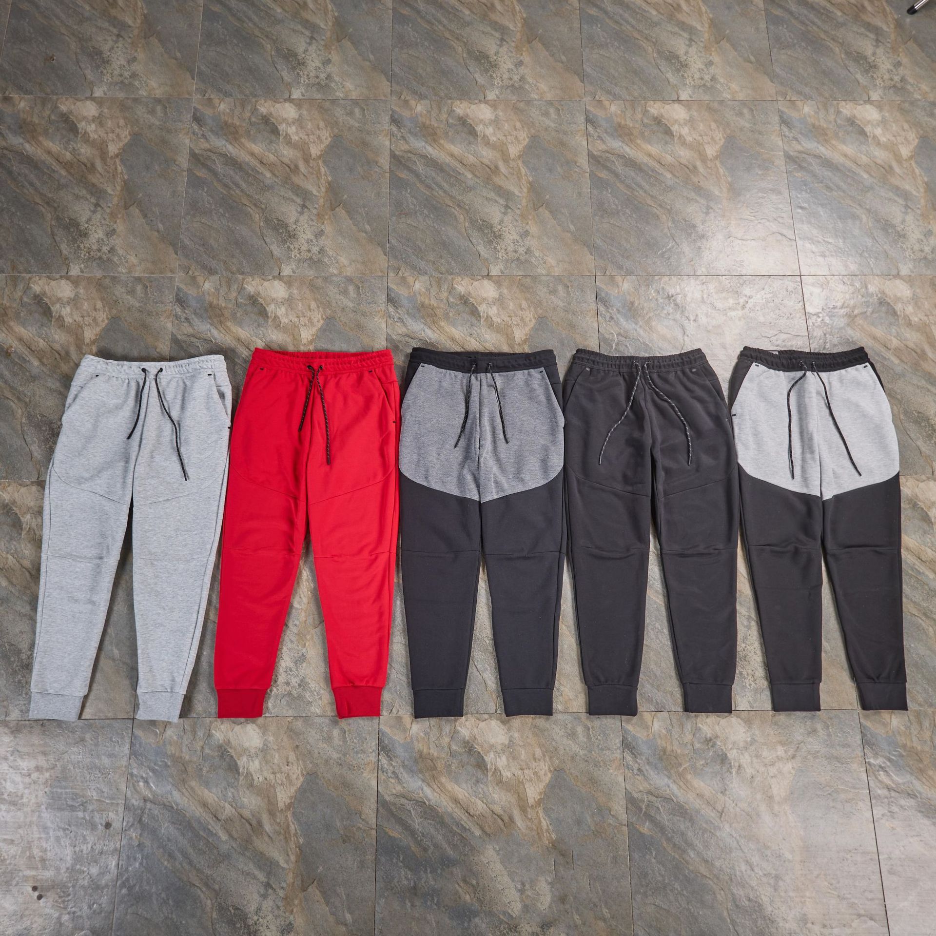 Pantalones casuales deportivos primavera y otoño aire laminado de algodón con cremallera pantalones deportivos para hombres y mujeres