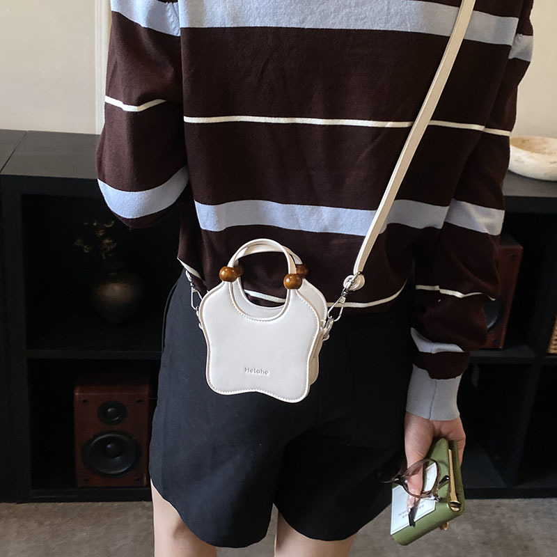 Bonita pequeña estrella en forma de bolso de hombro para niños y niñas, exquisita mini bolso de bebé, bolso para niños de comercio exterior transfronterizo