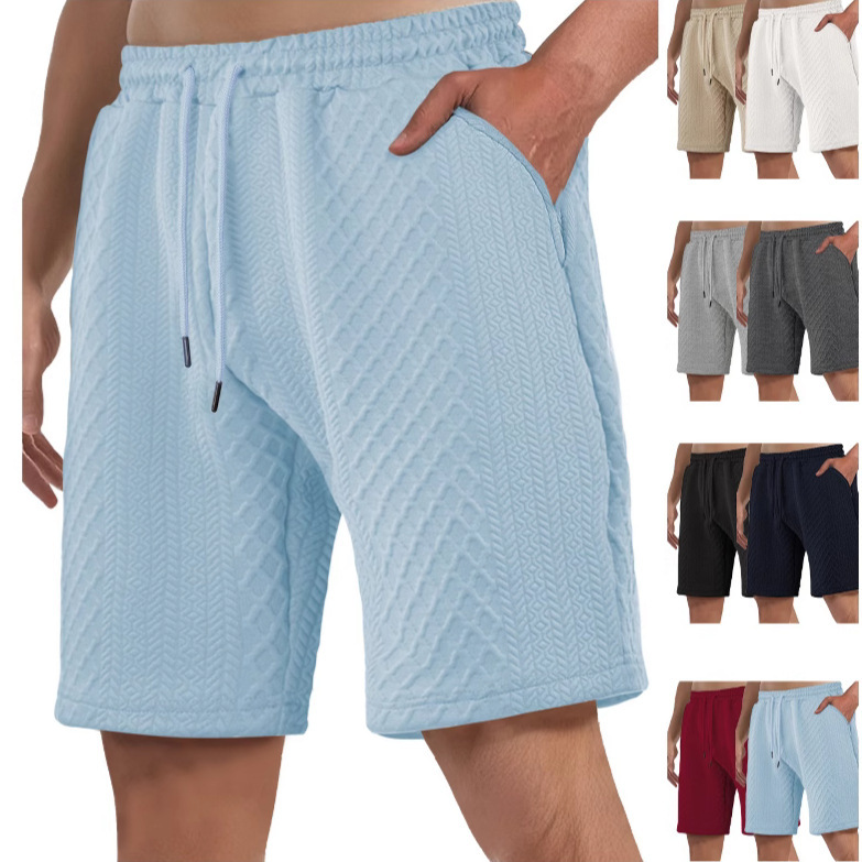 Europa y Estados Unidos ropa de hombre transfronteriza spot verano suelta pantalones cortos de color sólido jacquard correa de hombre casual pantalones cortos de playa