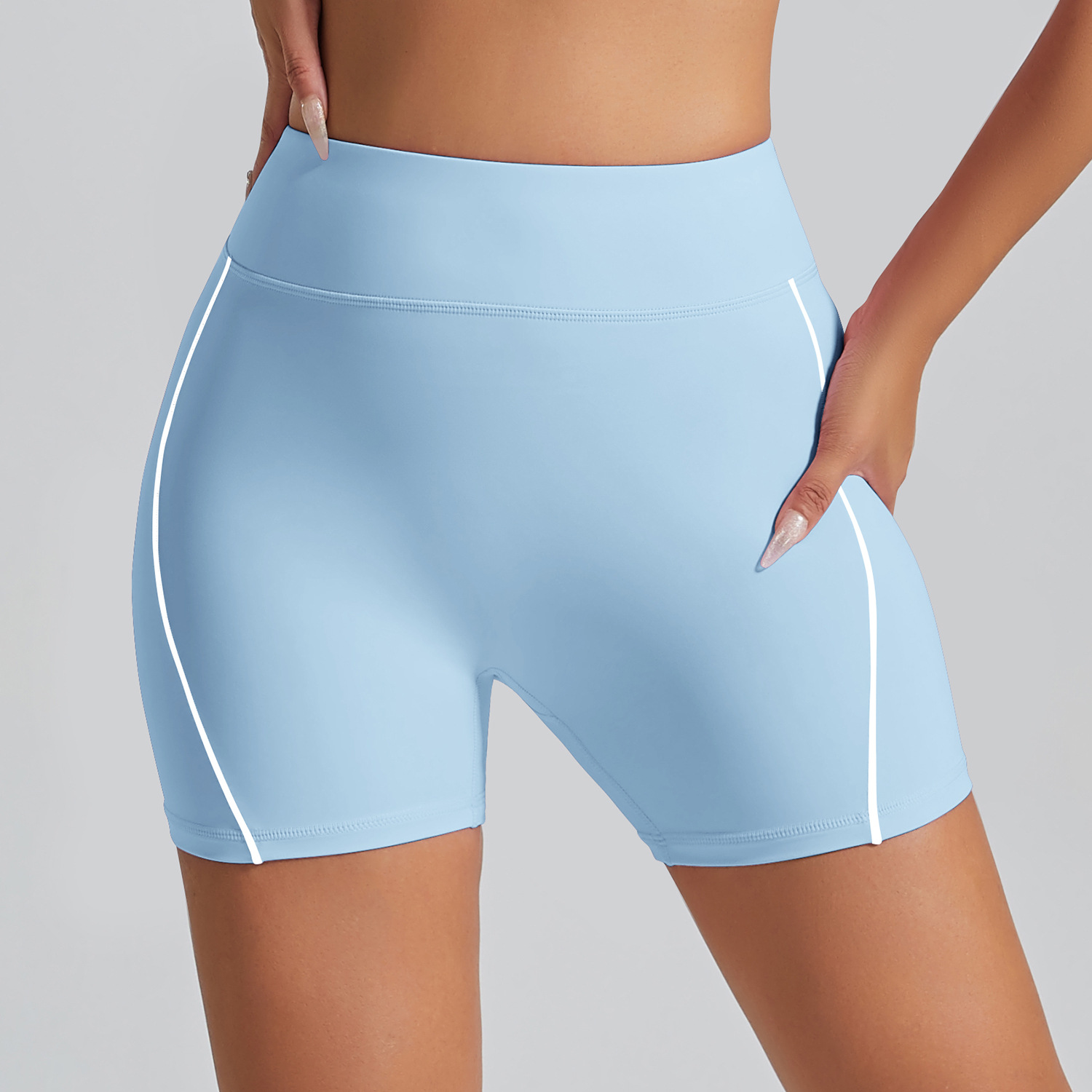 Pantalones cortos deportivos de color de contraste europeo y americano sin línea de vergüenza Cintura alta, ajustados desnudos, pantalones de yoga de fitness de cadera de melocotón, pantalones de tres puntos