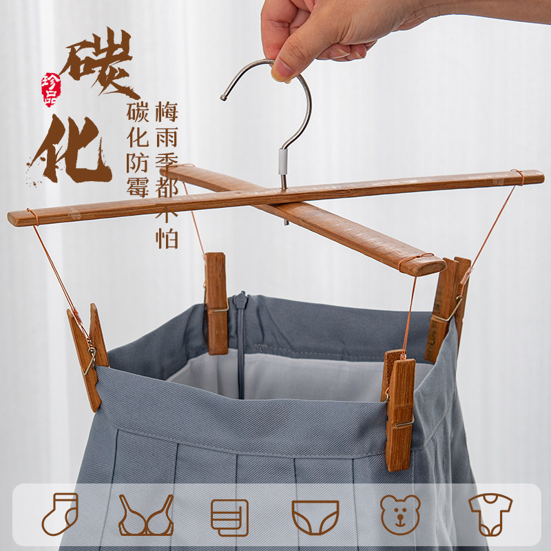 Mildew-resistant carbonized cross-shaped bamboo pants rack, thickened vintage-style household pants hanger with four clips, specially designed for drying pants without leaving marks Mildew-resistant carbonized cross-shaped bamboo pants rack, thickened vintage-style household pants hanger with four clips, specially designed for drying pants without leaving marks
