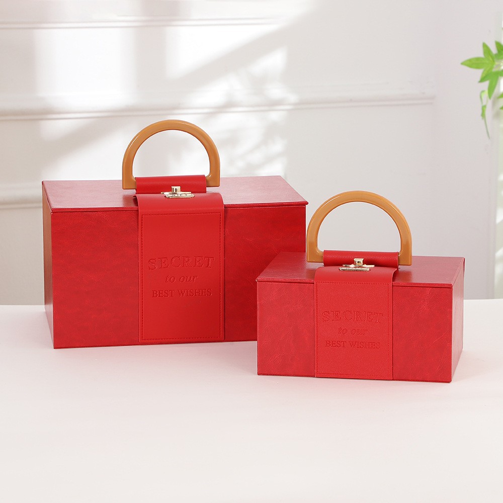 2023 nueva caja de regalo portátil regalo Festival de Primavera caja de embalaje de cuero caja de dulces de boda caja de regalo de mano al por mayor