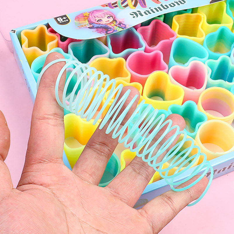 Heart-shaped magic rainbow ring mini spring ring telescopic stacking elastic ring to push hot selling small toys gifts wholesale