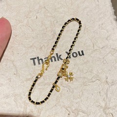 Xiaohongshu Douyin 人気の DIY クロスブラックゴールドブレスレット新しいファッションライト高級織りブレスレットハイエンドで多用途
