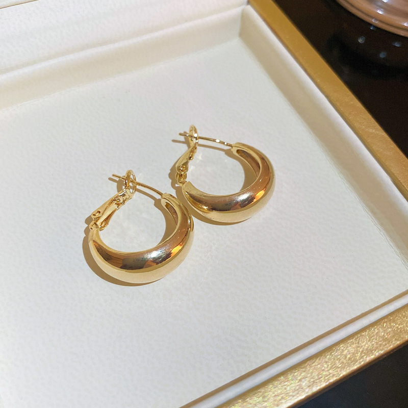 Pendientes de alta gama de lujo ligero transfronterizo de aguja de plata de galvanoplastia de oro real, pendientes de personalidad de nicho, pendientes de alta gama de moda al por mayor