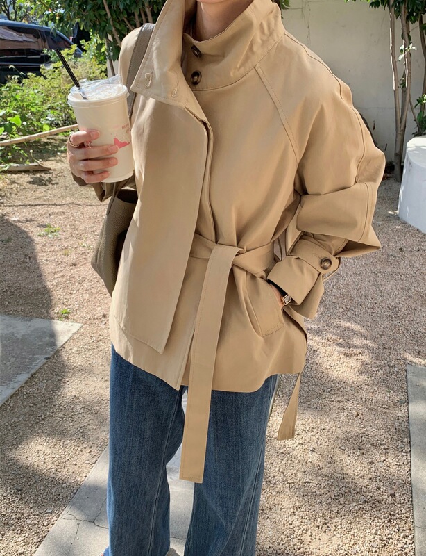Korean Dongdaemun autumn new arrivals: Korean-style niche design irregular back-button short trench coat for women Korean Dongdaemun autumn new arrivals: Korean-style niche design irregular back-button short trench coat for women
